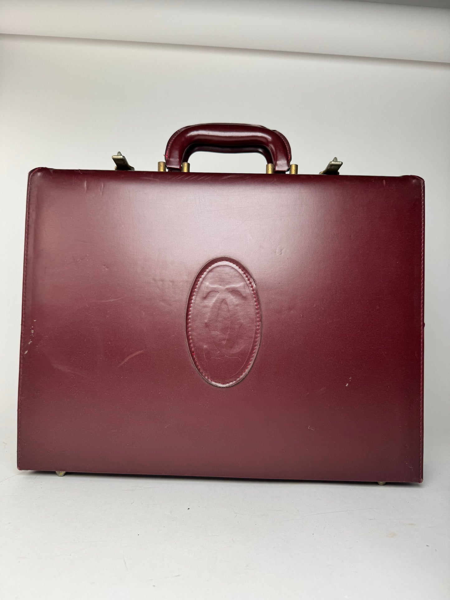 Valise vintage Cartier en cuir bordeaux