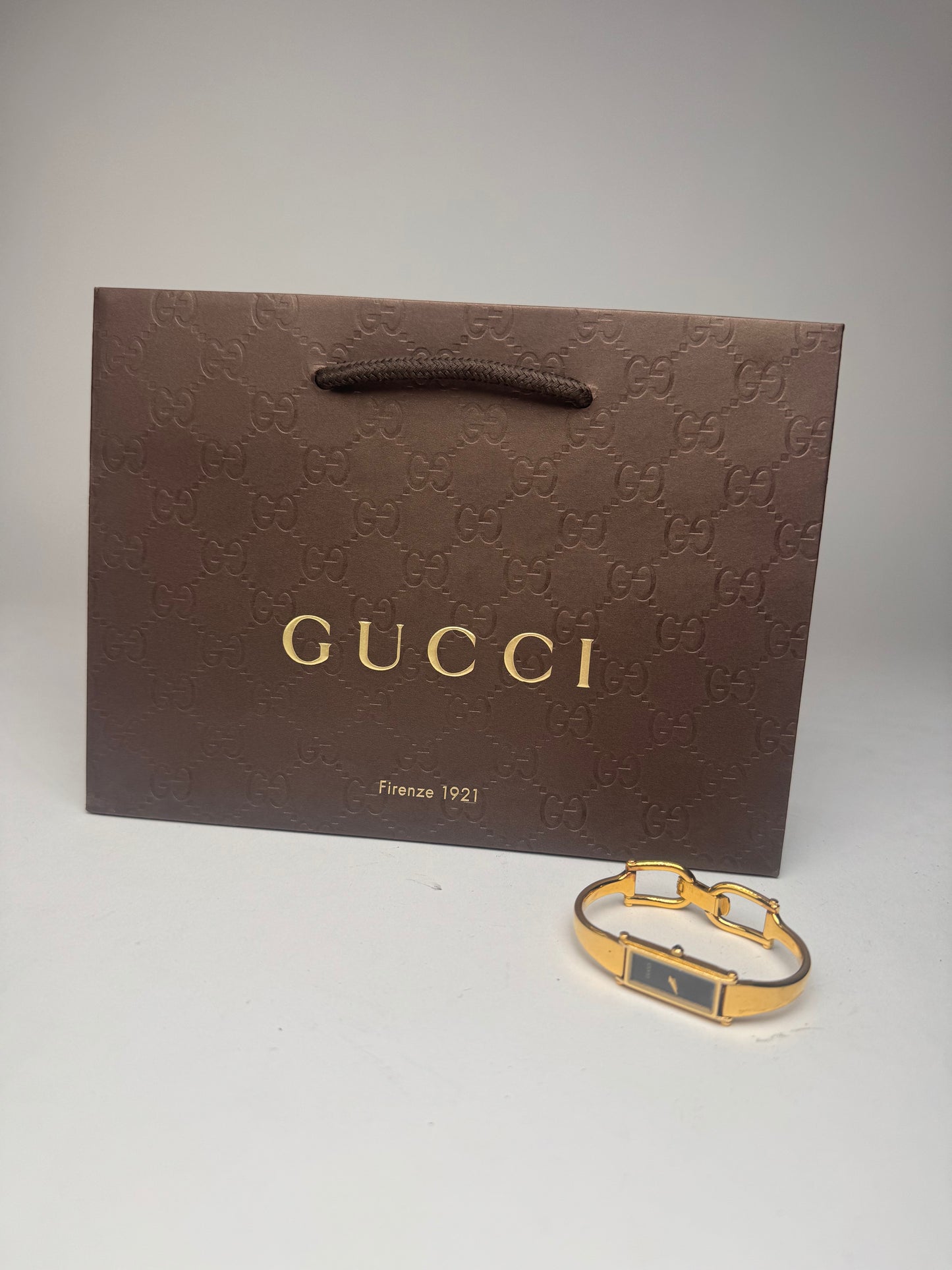 Montre Gucci vintage en acier et or avec mors