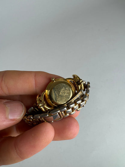 Montre Gucci vintage à quartz en acier avec mors doré
