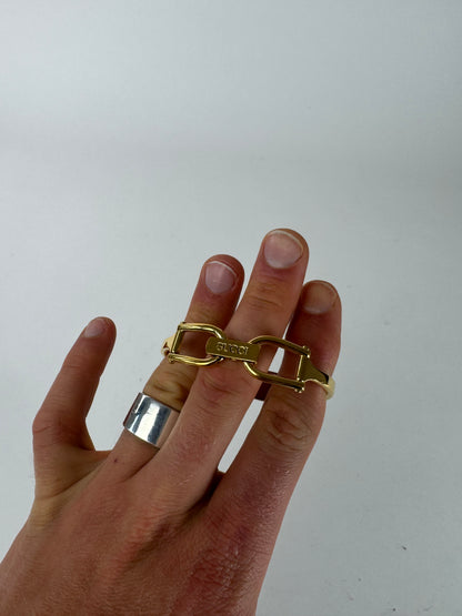 Montre Gucci vintage en acier avec mors de cheval doré