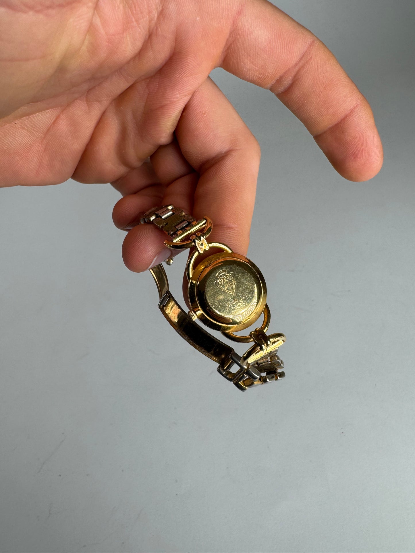 Montre Gucci vintage à quartz en acier avec mors doré