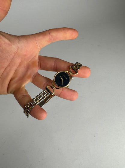 Montre Gucci vintage à quartz en acier avec mors doré