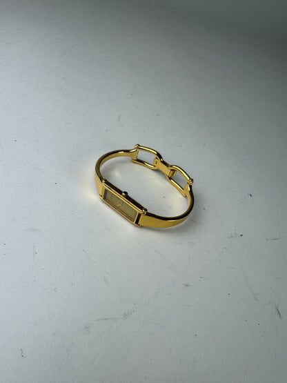 Montre Gucci vintage en acier avec mors de cheval doré