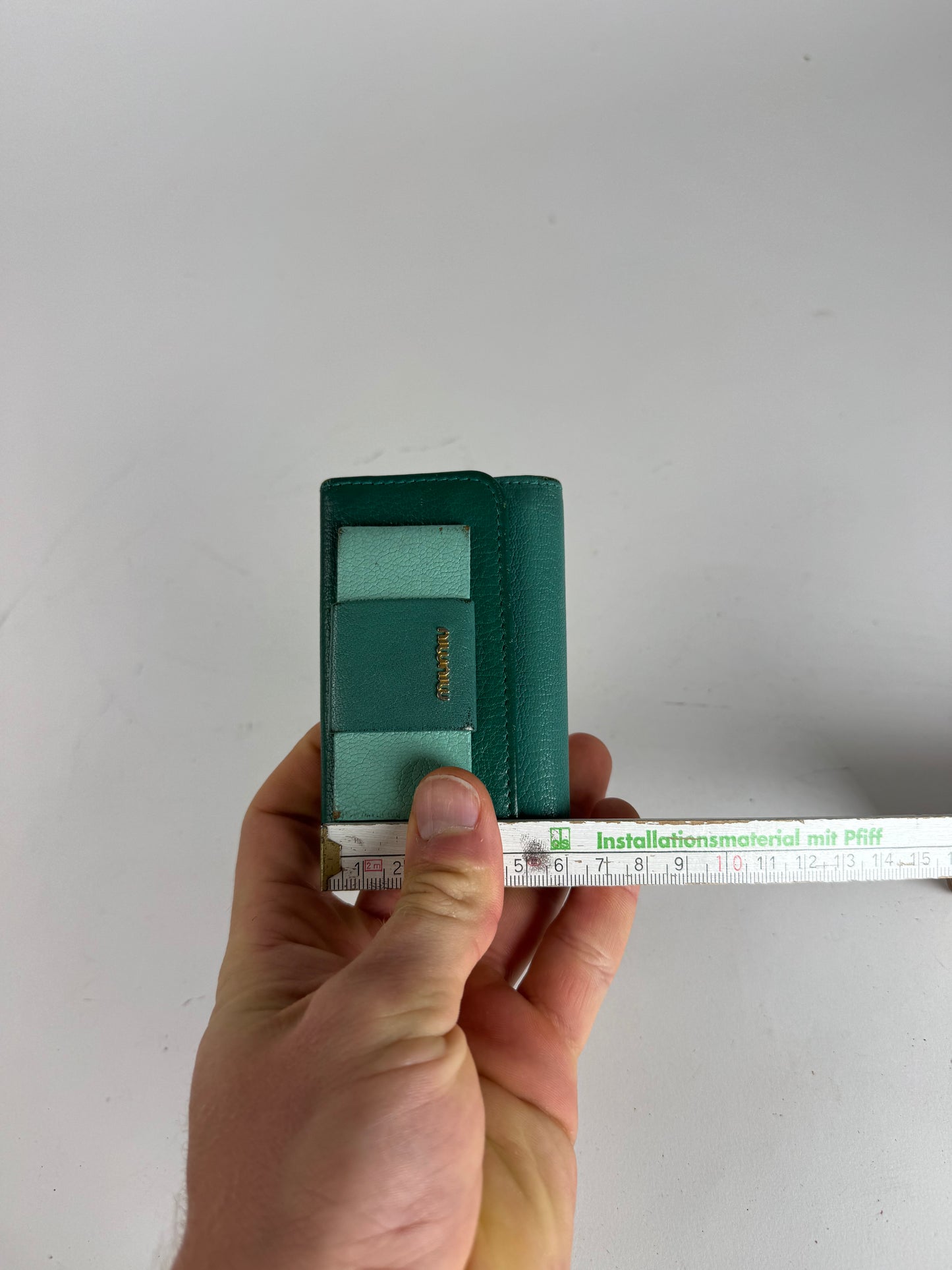 Porte-clés vintage en cuir vert Miu Miu