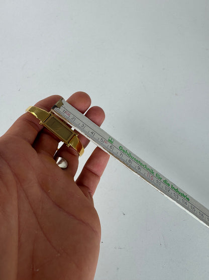 Montre Gucci vintage en acier avec mors de cheval doré