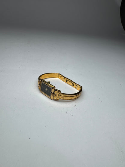 Montre vintage Givenchy en acier à quartz doré Millesime