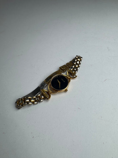 Montre Gucci vintage à quartz en acier avec mors doré