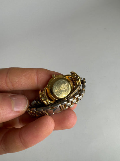 Montre Gucci vintage à quartz en acier avec mors doré