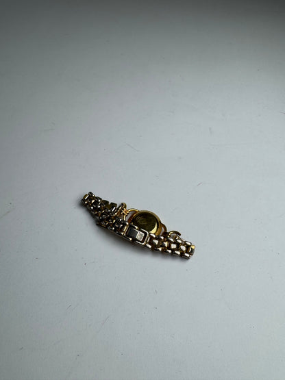 Montre Gucci vintage à quartz en acier avec mors doré