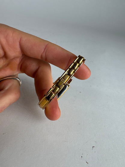 Montre vintage Givenchy en acier à quartz doré Millesime