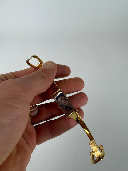 Montre Gucci vintage en acier avec mors de cheval doré