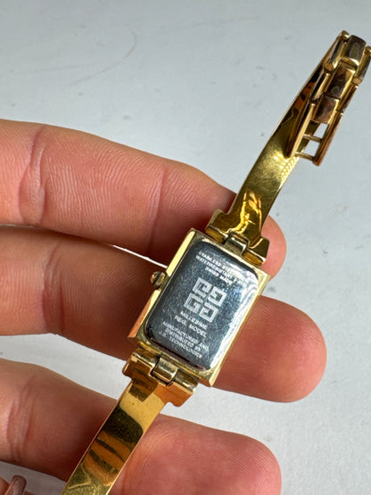 Montre vintage Givenchy en acier à quartz doré Millesime