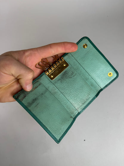 Porte-clés vintage en cuir vert Miu Miu