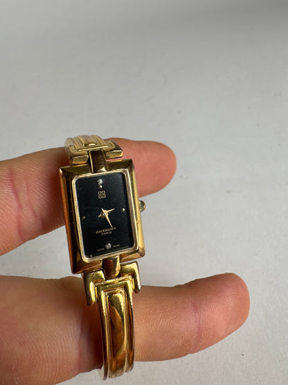 Montre vintage Givenchy en acier à quartz doré Millesime