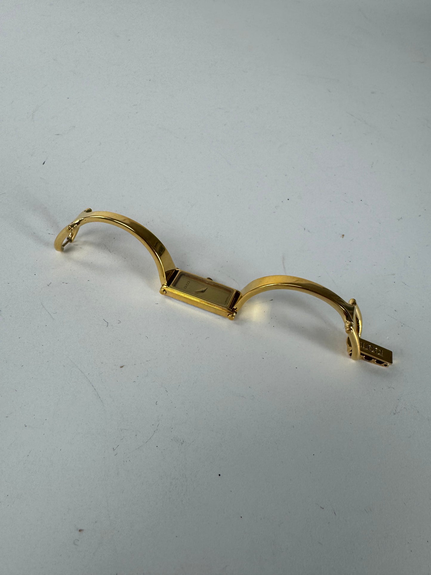 Montre Gucci vintage en acier avec mors de cheval doré