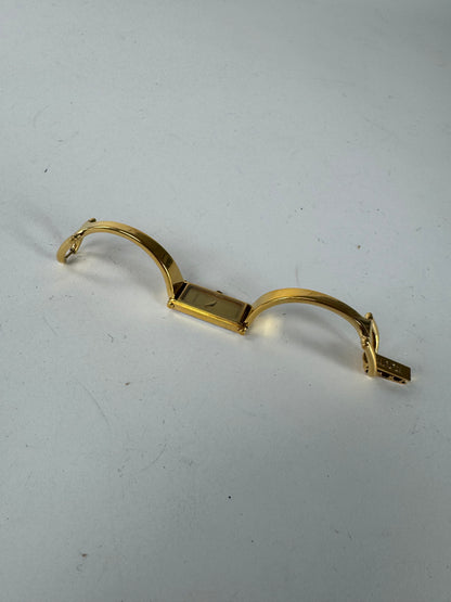 Montre Gucci vintage en acier avec mors de cheval doré