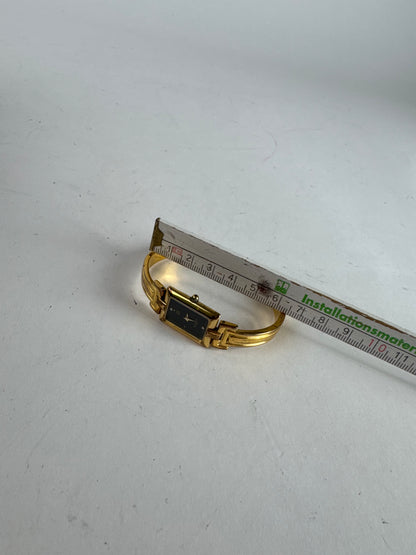 Montre vintage Givenchy en acier à quartz doré Millesime