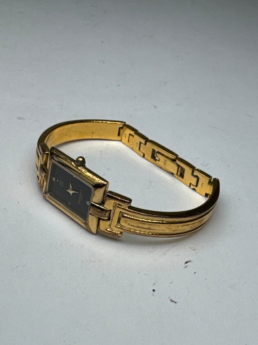 Montre vintage Givenchy en acier à quartz doré Millesime