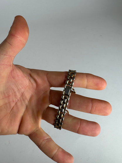 Montre Gucci vintage à quartz en acier avec mors doré