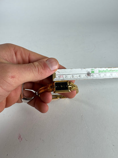 Montre vintage Givenchy en acier à quartz doré Millesime