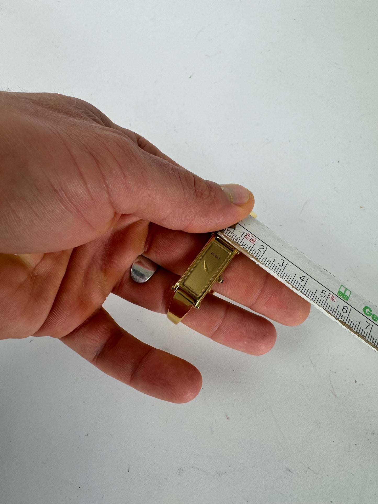 Montre Gucci vintage en acier avec mors de cheval doré