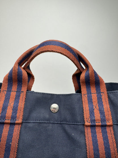 Sac cabas vintage Hermès en toile bleu marine rouge