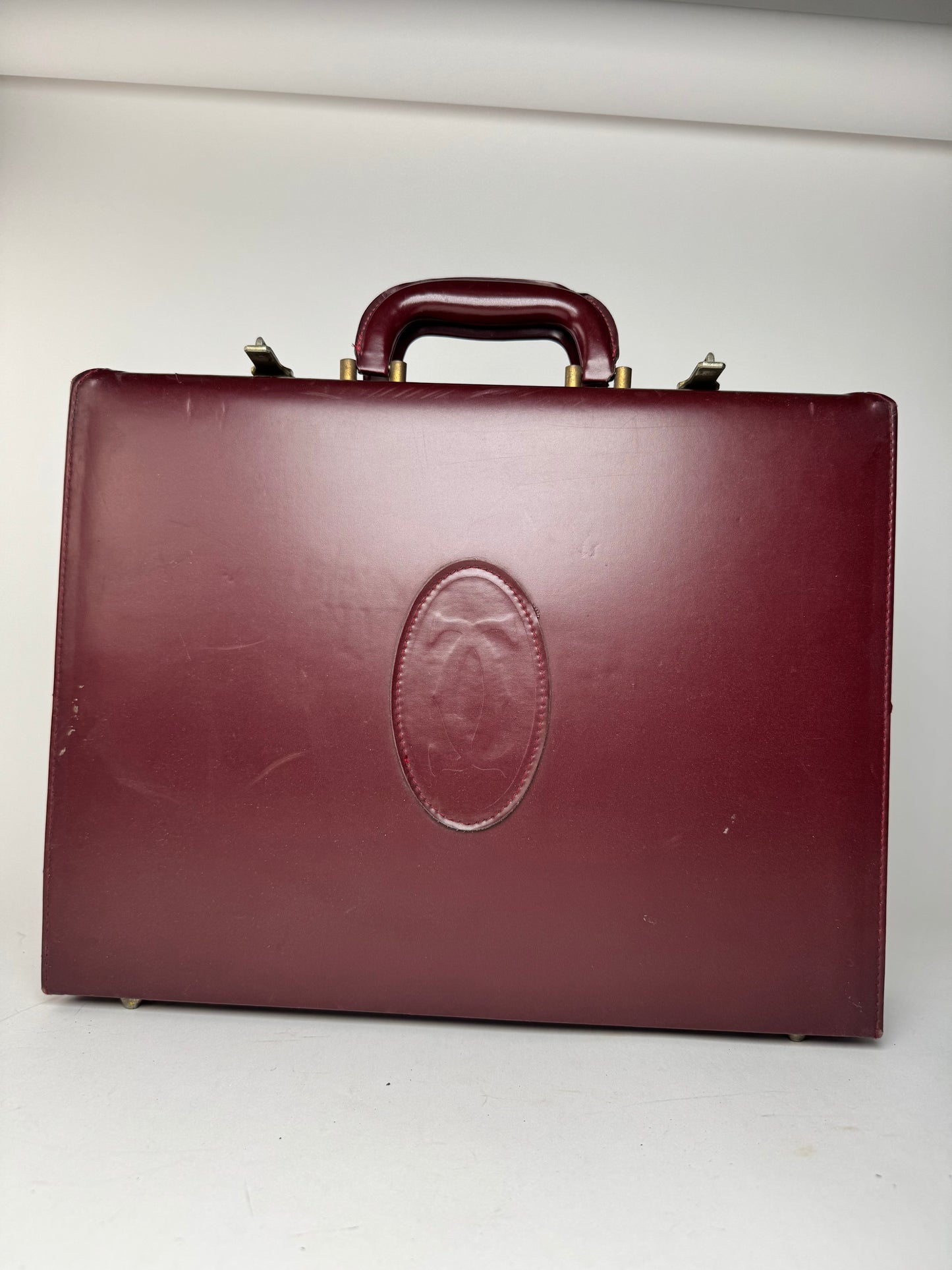 Valise vintage Cartier en cuir bordeaux