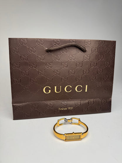 Montre Gucci vintage en acier et or avec mors
