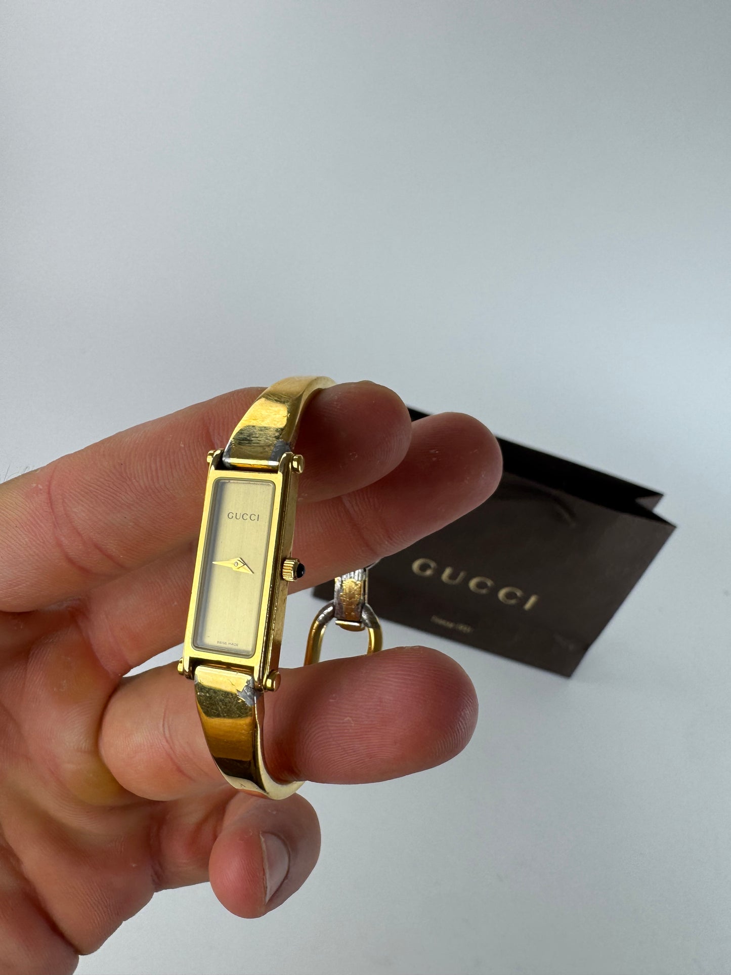 Montre Gucci vintage en acier et or avec mors