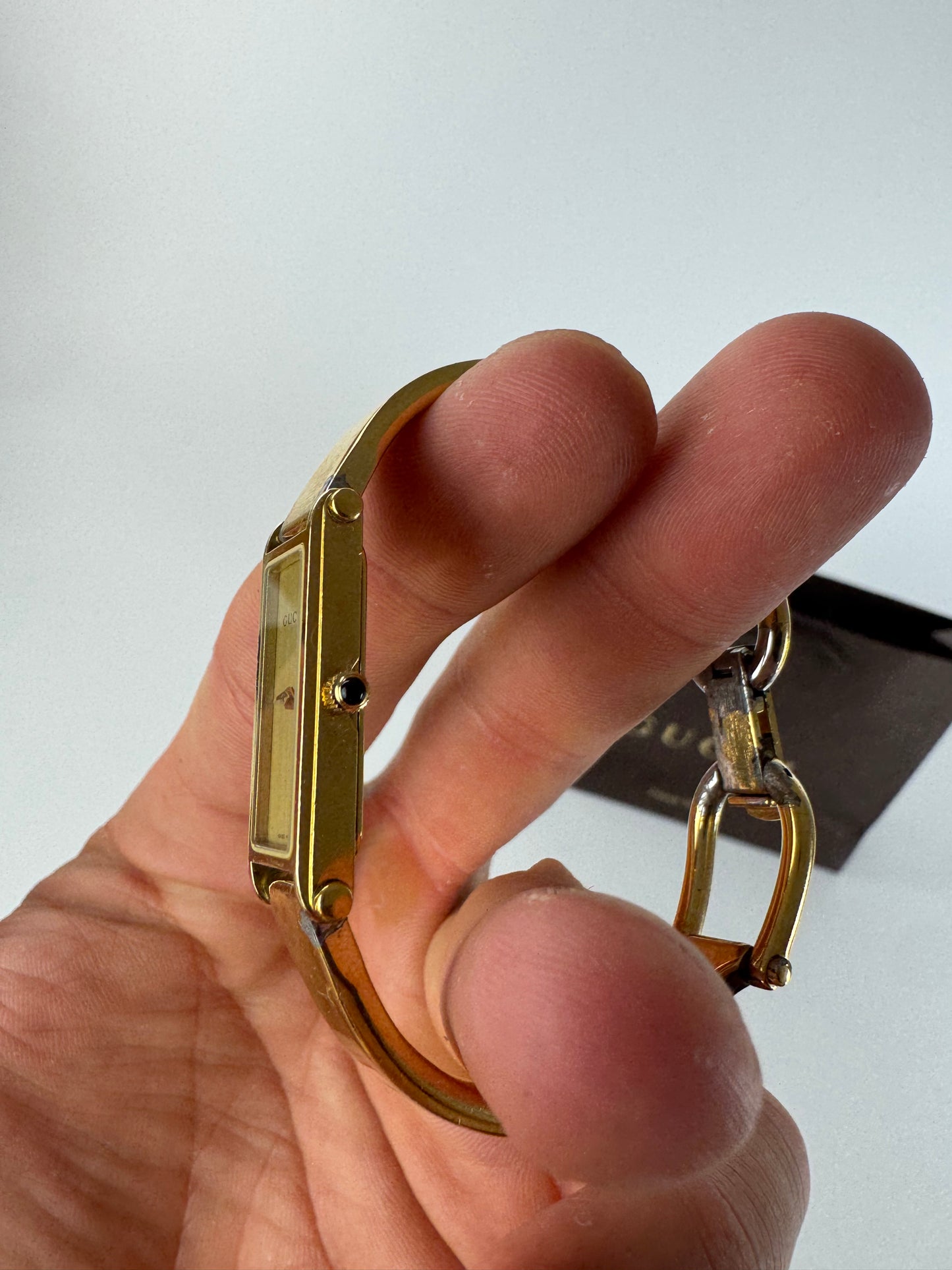 Montre Gucci vintage en acier et or avec mors