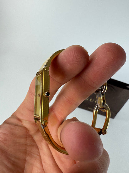 Montre Gucci vintage en acier et or avec mors