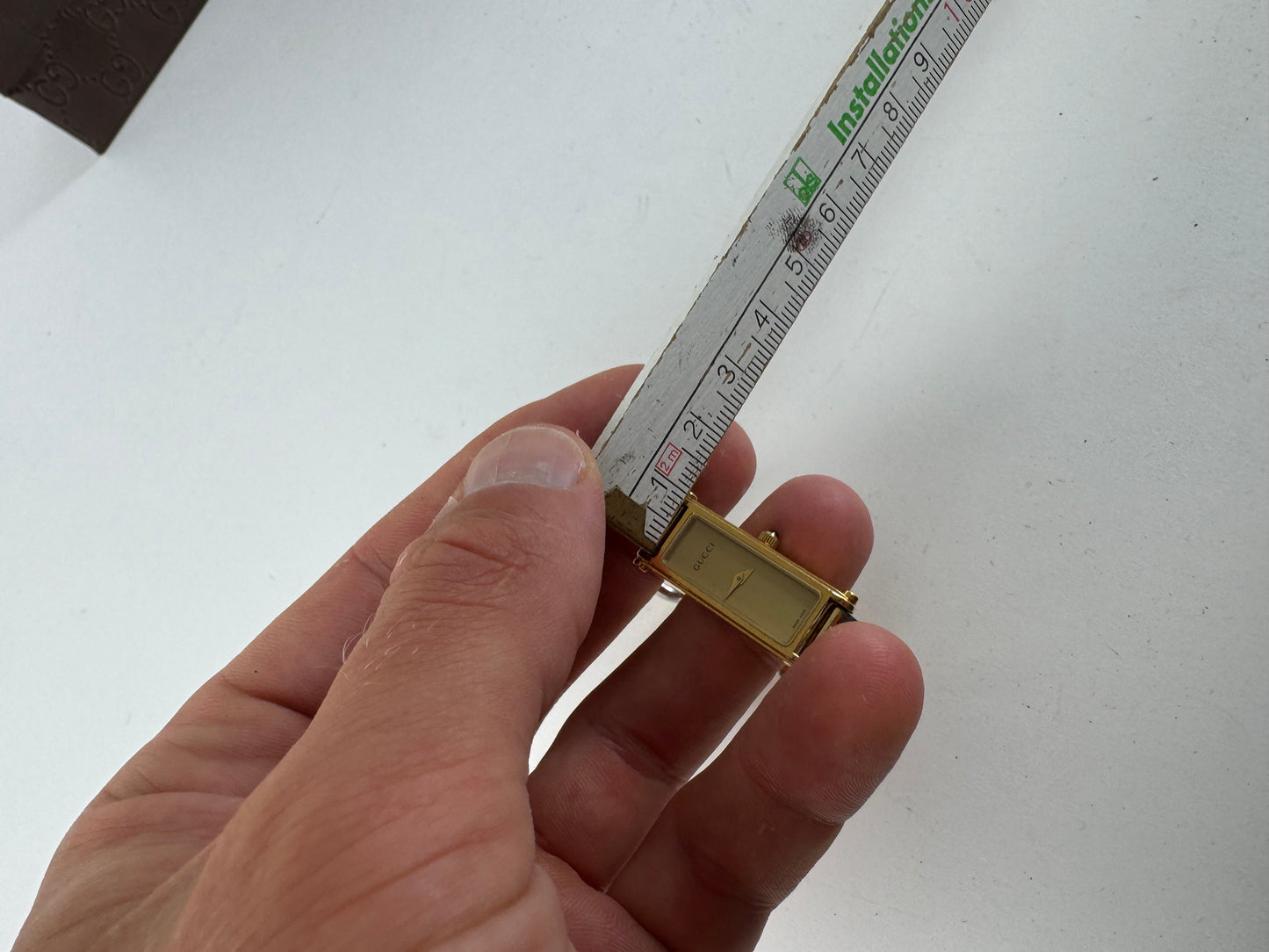 Montre Gucci vintage en acier et or avec mors