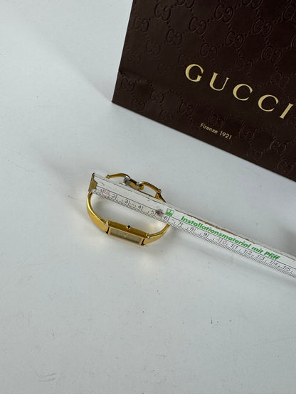 Montre Gucci vintage en acier et or avec mors