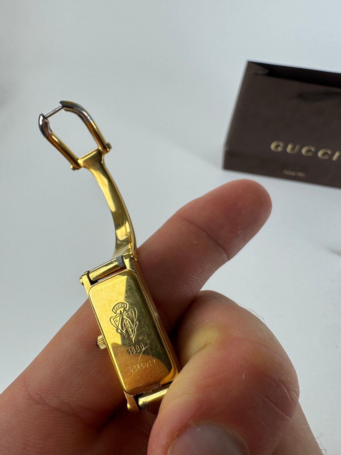 Montre Gucci vintage en acier et or avec mors