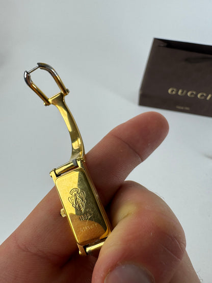 Montre Gucci vintage en acier et or avec mors