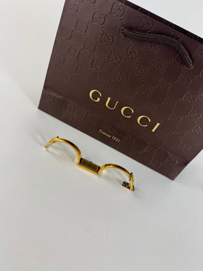 Montre Gucci vintage en acier et or avec mors