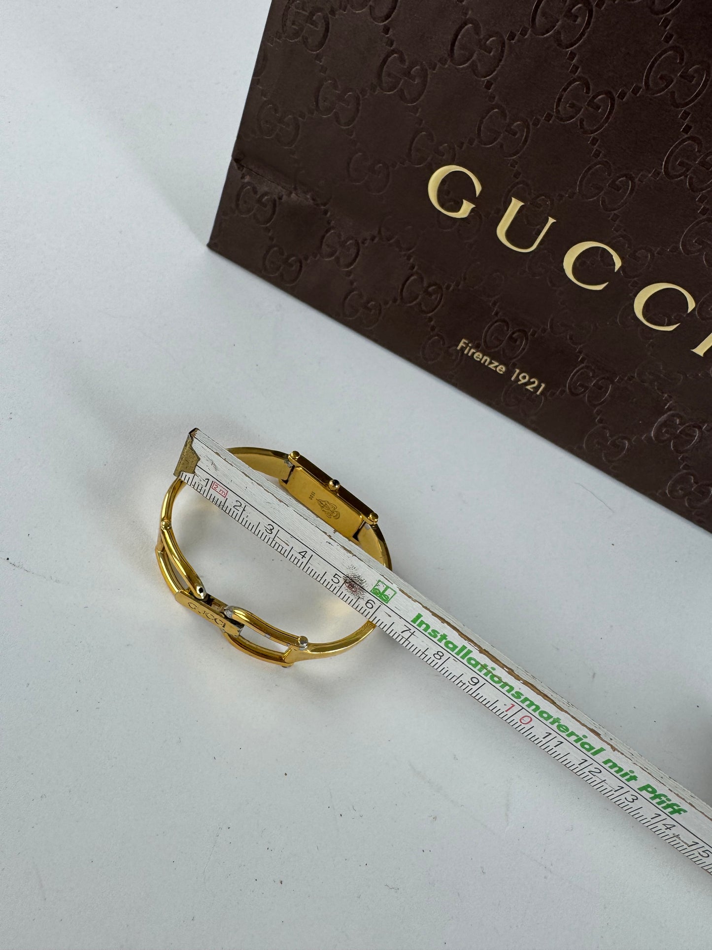 Montre Gucci vintage en acier et or avec mors