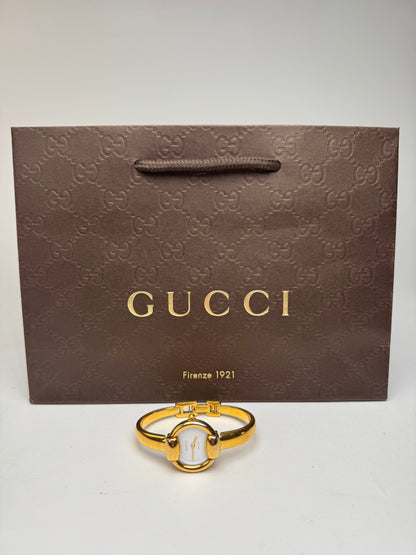 Montre Gucci vintage à mors doré