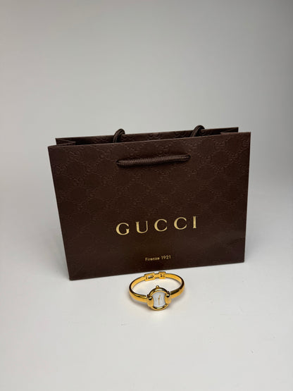 Montre Gucci vintage à mors doré