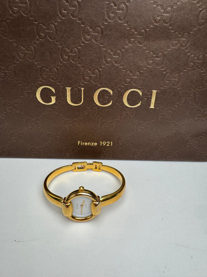 Montre Gucci vintage à mors doré