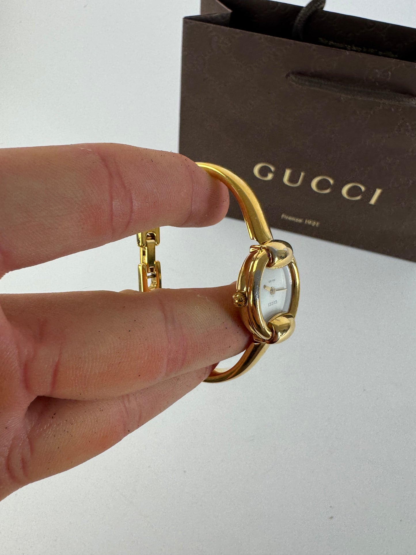 Montre Gucci vintage à mors doré