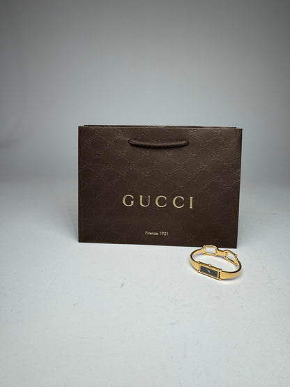 Montre Gucci vintage à mors en or