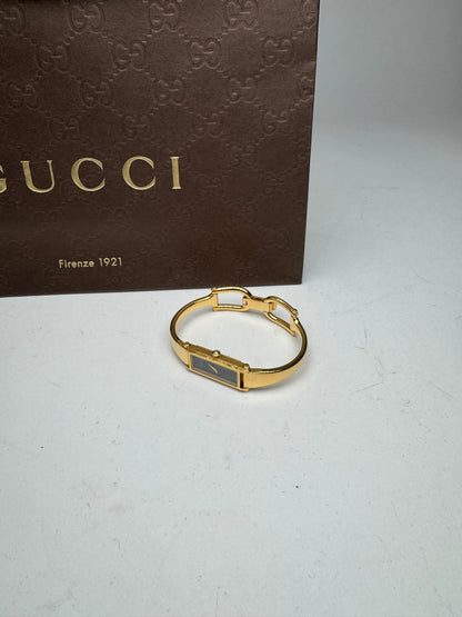 Montre Gucci vintage à mors en or