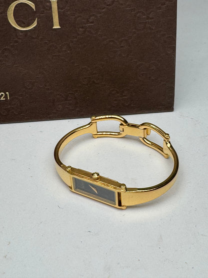 Montre Gucci vintage à mors en or