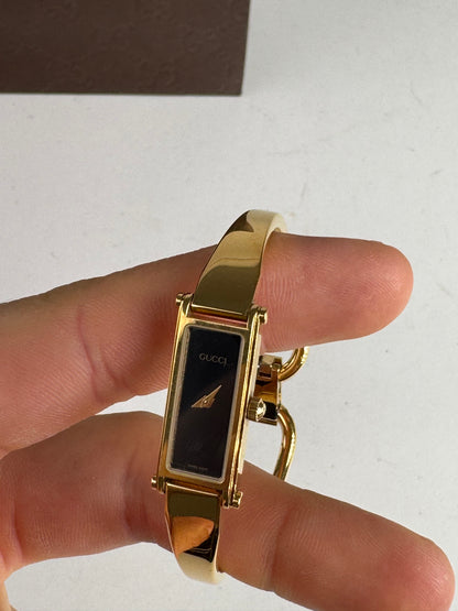 Montre Gucci vintage à mors en or