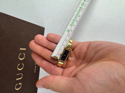 Montre Gucci vintage à mors en or