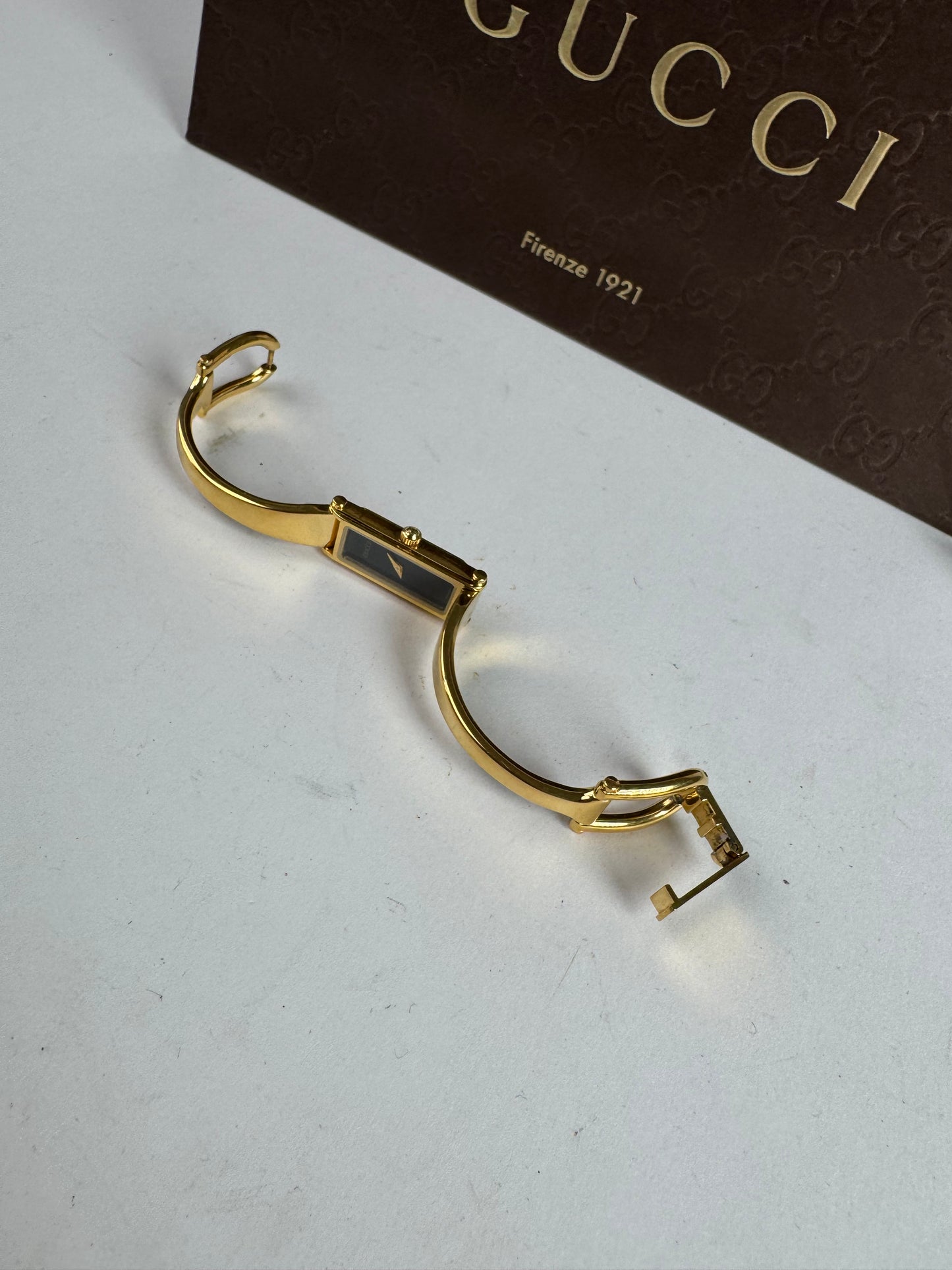 Montre Gucci vintage à mors en or