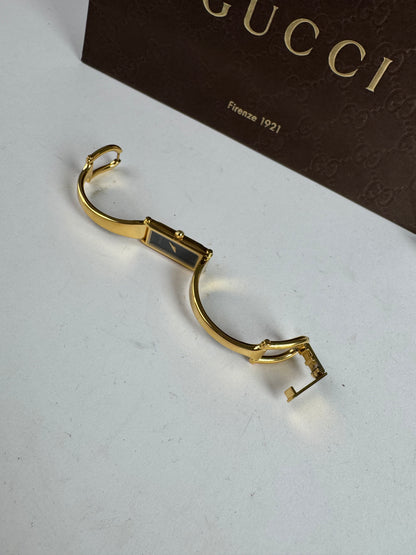 Montre Gucci vintage à mors en or