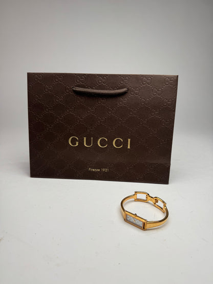 Montre Gucci vintage à mors en or