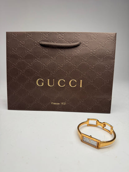 Montre Gucci vintage à mors en or